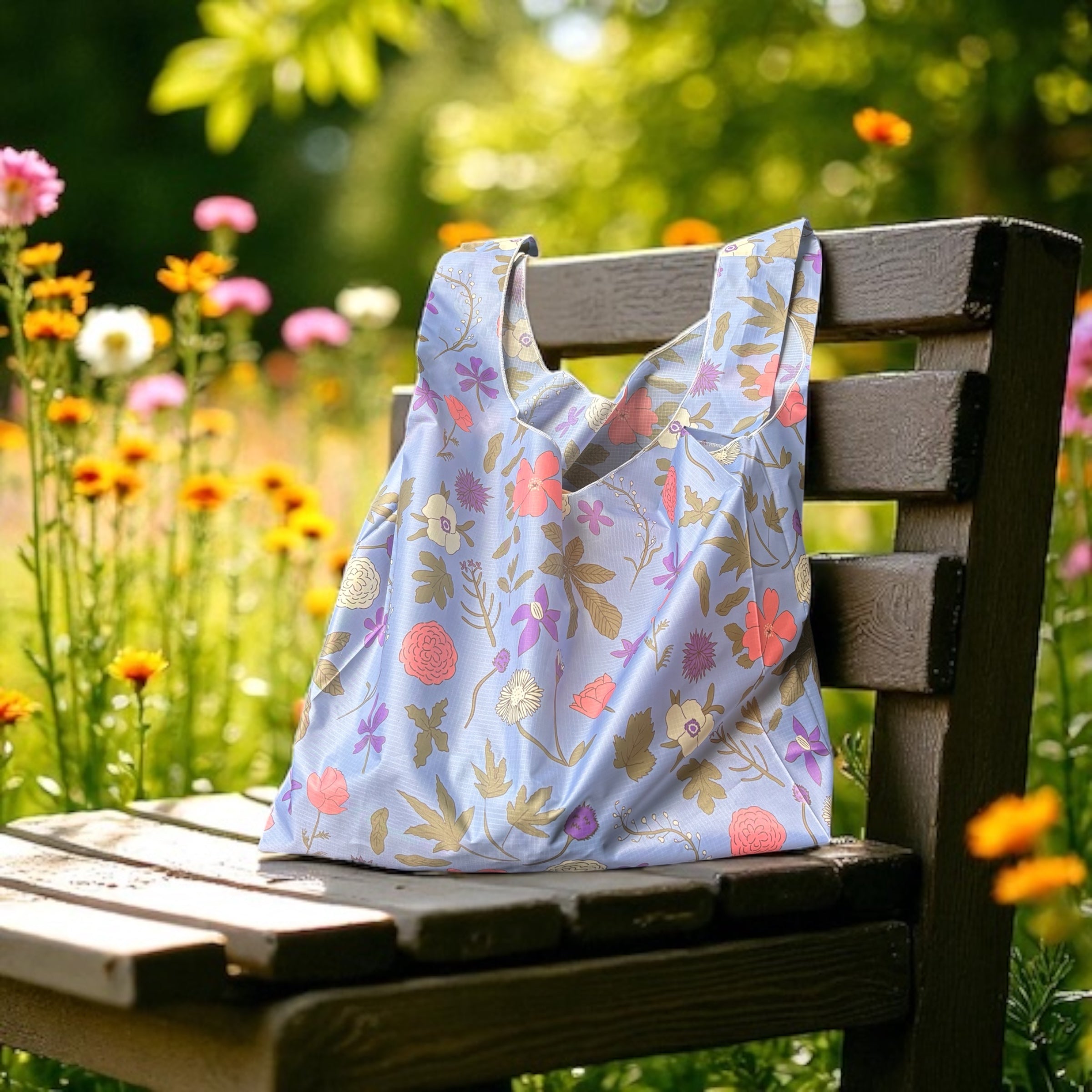 Floral-patterned bag on a wooden chair with a garden background